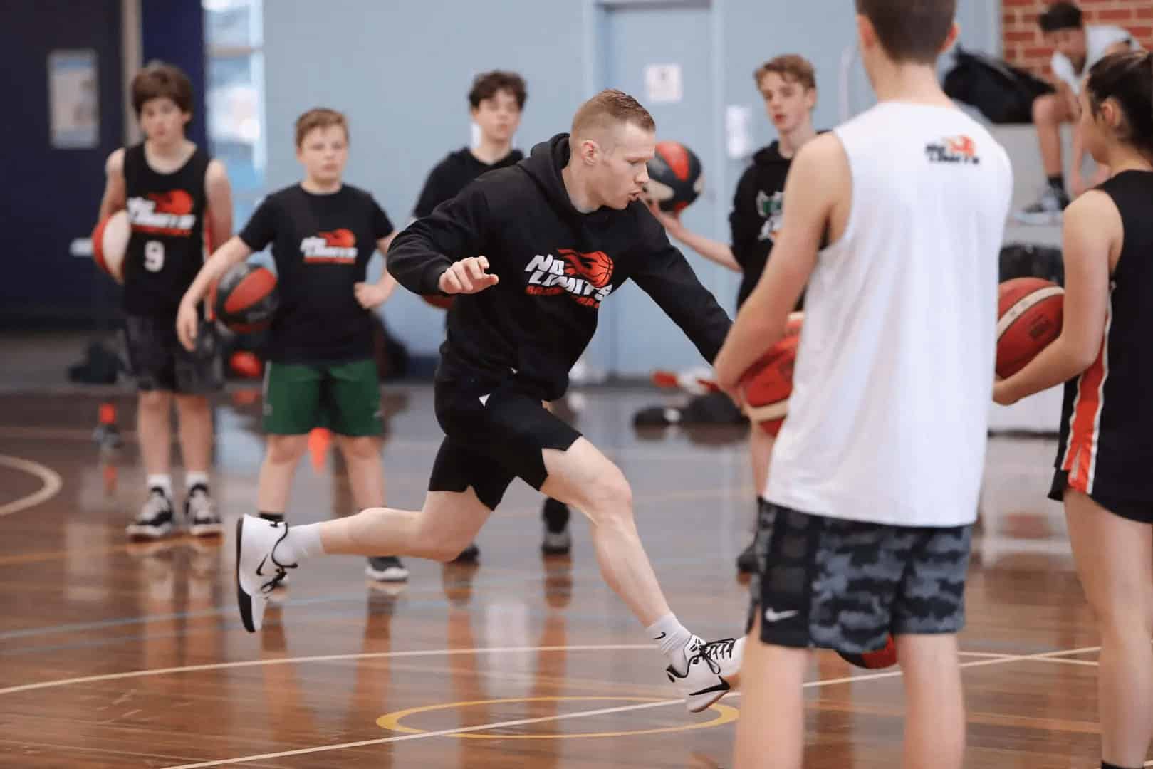 Basketball training session with young players at No Limits Basketball, focusing on skill development and teamwork in Australia.