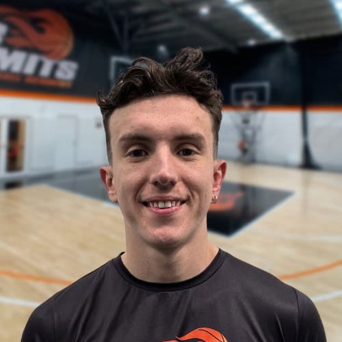 Young male basketball player smiling at No Limits Basketball gym in Australia.
