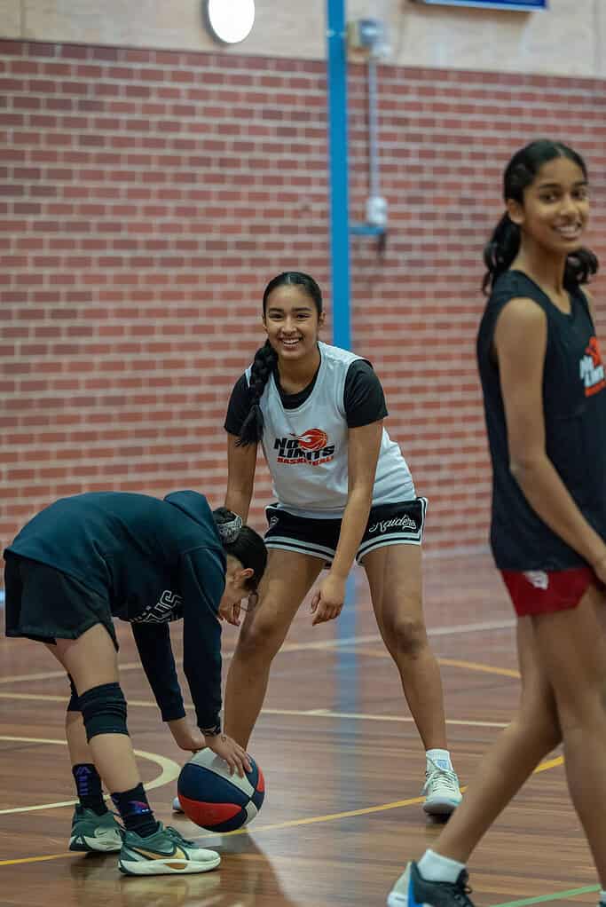 Young girls practicing basketball drills at No Limits Basketball.