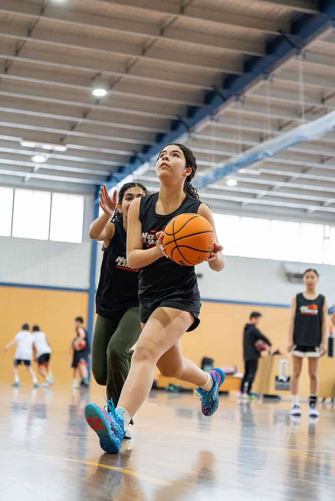 Young female basketball player shooting during training at No Limits Basketball.