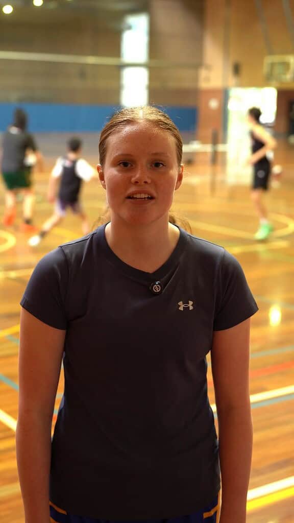 Young girl in basketball gym during No Limits Basketball camp.